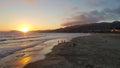 Pismo Beach Sunset with Reflections of Sun off Sand Royalty Free Stock Photo