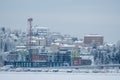 Pispala Shot Tower in Tampere, Finland surrounded with trees and old and new buildings during winter Royalty Free Stock Photo