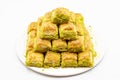 Pistachio baklava dessert on a white background. Traditional Turkish cuisine delicacies. Close-up Pistachio Baklava Royalty Free Stock Photo