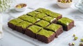 Pistachio brownies cut into squares on parchment paper Royalty Free Stock Photo