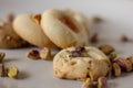 Pistachio butter cookies oven fresh,with pistachios sprinkled in  on top of them isolated in a white background. Royalty Free Stock Photo