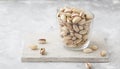 Pistachio in glass. Nuts. Green fresh pistachios as texture. Roasted salted pistachio nuts healthy delicious food studio photo. Royalty Free Stock Photo