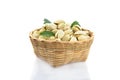 Pistachio and green leaf in bamboo basket isolated on white background Royalty Free Stock Photo