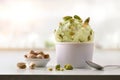 Pistachio ice cream cup on white table homemade in kitchen Royalty Free Stock Photo