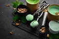 Pistachio ice cream with mint and pistachios. Ice cream spoon. On a black stone background Royalty Free Stock Photo