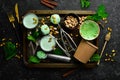 Pistachio ice cream with mint and pistachios. Ice cream spoon. On a black stone background Royalty Free Stock Photo