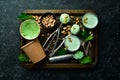 Pistachio ice cream with mint and pistachios. Ice cream spoon. On a black stone background Royalty Free Stock Photo