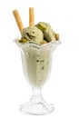 Pistachio ice cream sundae with waffles and pistachio kernel isolated on white background - front view Royalty Free Stock Photo