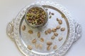 pistachio nut inshell and without shell on a platter view from the top Royalty Free Stock Photo