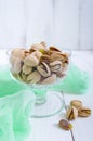 Pistachio nuts in a bowl on white background. Royalty Free Stock Photo