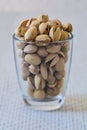 Pistachio nuts in a jar on a white background Royalty Free Stock Photo