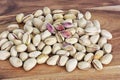 Pistachio nuts unhusked on the bench Royalty Free Stock Photo