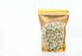 Pistachio nuts in window pouch packaging with uncleared plastic, zip-lock on top, gold colour packaging. Front view with blank Royalty Free Stock Photo