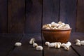 Pistachio nuts on wooden background. Roasted salted pistachios