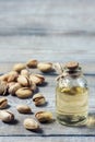 Pistachio oil with nuts. Royalty Free Stock Photo