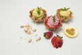Pistachio pation fruit and strawberry ice creams on white background with accompanying fruits Royalty Free Stock Photo