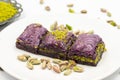 Pistachio purple baklava on a white background. Baklava specially prepared for diabetics.