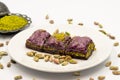 Pistachio purple baklava on a white background. Baklava specially prepared for diabetics.