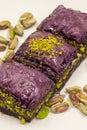 Pistachio purple baklava on a white background. Baklava specially prepared for diabetics. Traditional Mediterranean cuisine delica