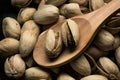 Pistachios closeup over wooden spoon