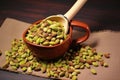 pistachios gathered in a stylish ceramic shovel on a table