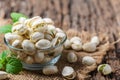 Pistachios in.Glass cup on old wood background. Healthy nut concept Royalty Free Stock Photo