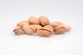 A handful of organic pistachios in white background Royalty Free Stock Photo