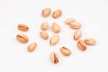 Organic pistachio nuts scattered on white background Royalty Free Stock Photo