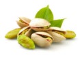 Pistachios with leaves on white background