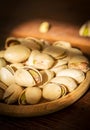 Pistachios nut in wood plate. Royalty Free Stock Photo