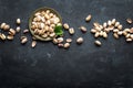 Pistachios nuts on dark background, top view, healthy snack Royalty Free Stock Photo