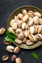 Pistachios nuts on dark background, top view, healthy snack Royalty Free Stock Photo