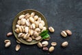 Pistachios nuts on dark background, top view, healthy snack Royalty Free Stock Photo