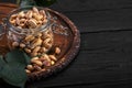 Pistachios nuts on dark background, top view, healthy snack Royalty Free Stock Photo