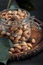 Pistachios nuts on dark background, top view, healthy snack Royalty Free Stock Photo