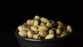 Pistachios, dried fruit, gyrating in a bowl