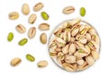 Pistachios. Nuts pistachios in shell. Roasted and salted Pistachio in glass bowl. Isolated on white background. Vegetarian snack. Royalty Free Stock Photo