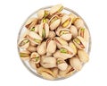 Pistachios. Nuts pistachios in shell. Roasted and salted Pistachio in glass bowl. Isolated on white background Royalty Free Stock Photo