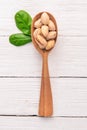 Pistachios nuts on a white wooden background. Healthy snacks. Top view.