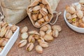 Pistachios in a sack and ceramic bowl