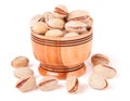 Pistachios in a wooden bowl isolated on white background Royalty Free Stock Photo