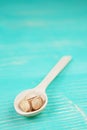 Pistachios on wooden spoon over wooden vintage background. Royalty Free Stock Photo