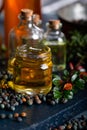 Pistacia terebinthus oil and dried seeds on dark wooden background