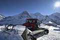 Pistenbully in front of Eiger, Moench and Jungfrau in Bernese Oberland, Switzerland