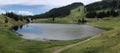 The Seebenalpsee, a secluded alpine lake on Flumserberg, Swiss Alps