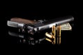 Pistol 1911 with ammunition on black Royalty Free Stock Photo