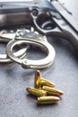 Pistol bullets, handgun and handcuffs. Royalty Free Stock Photo