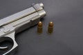 Pistol gun and bullets on black background Royalty Free Stock Photo