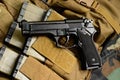 Pistol gun with military equipment Royalty Free Stock Photo