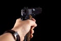 Pistol 1911 in hand on black Royalty Free Stock Photo